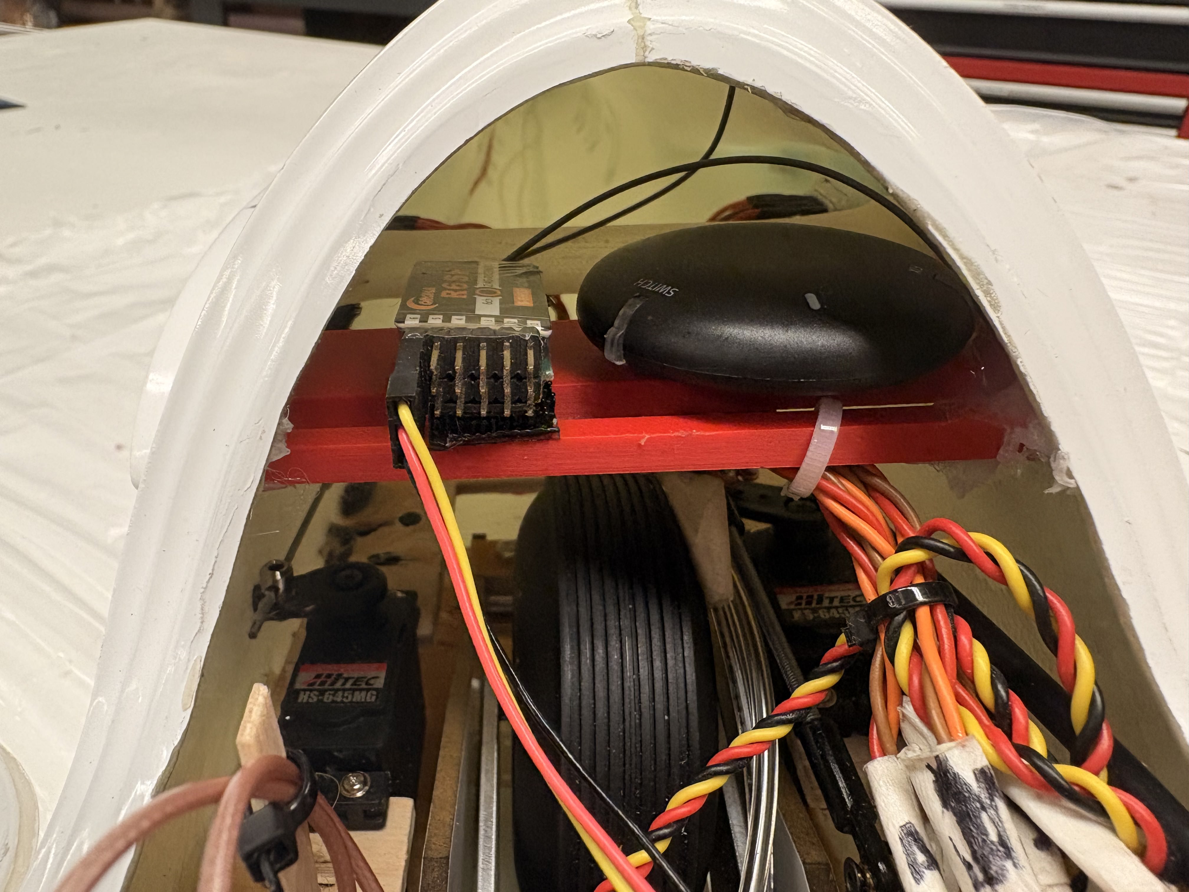 Corona R6SF receiver and HITEC HS-645MG servos wired inside the nose